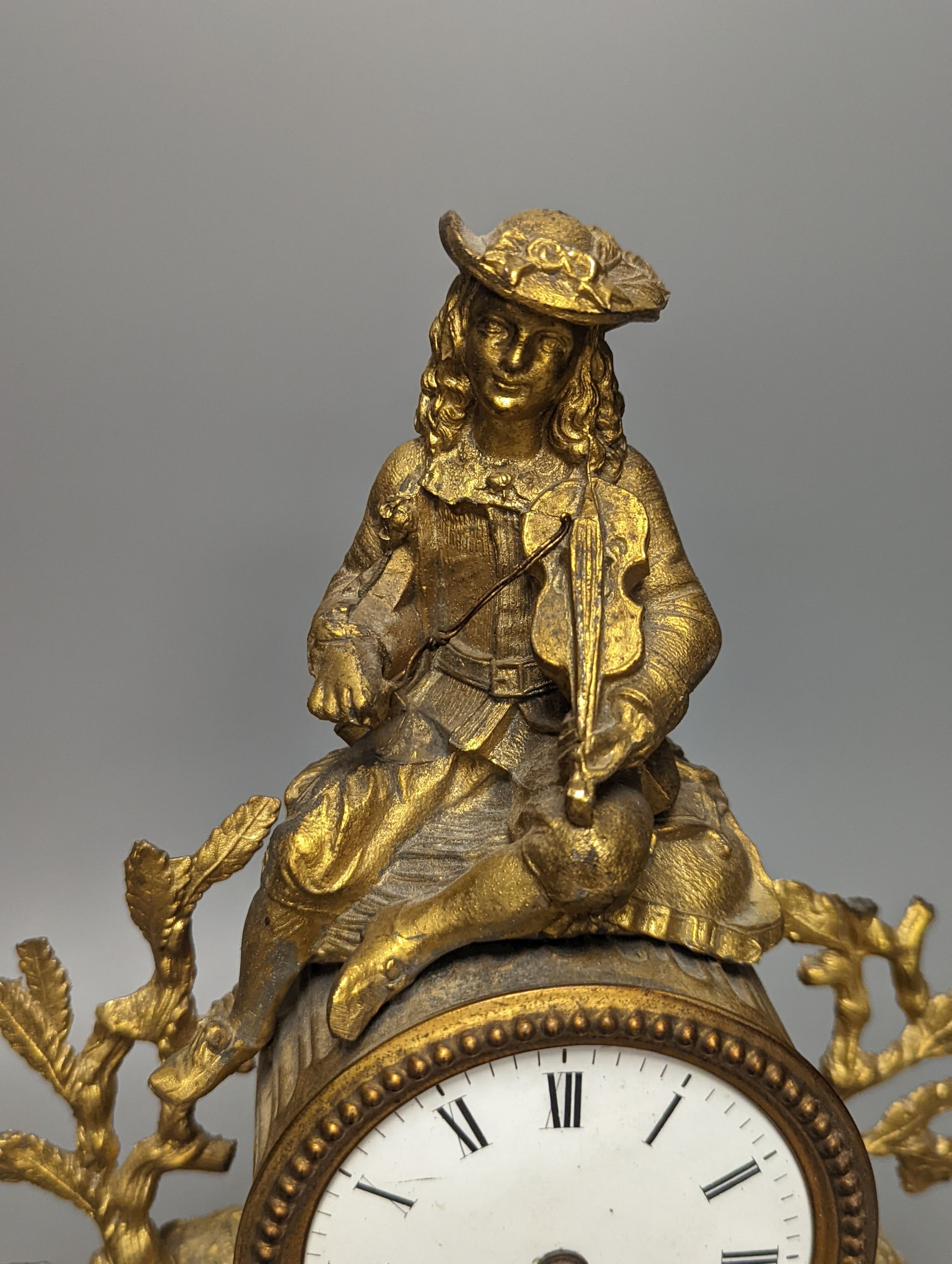 A 19th century French gilt spelter mantel timepiece, with pendulum, height 29cm